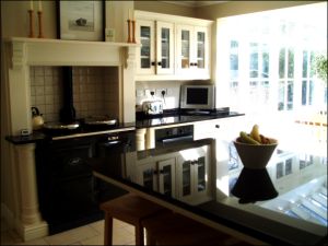 Image Of Absolute Black Granite Island, Oven And Kitchen Dresser